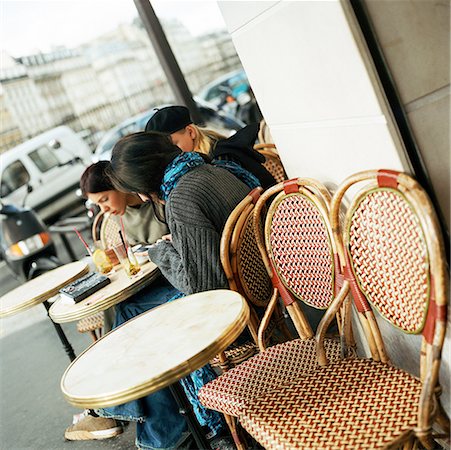 sidewalk cafe empty - Teenagers sitting at cafe terrace Stock Photo - Premium Royalty-Free, Code: 632-01137074