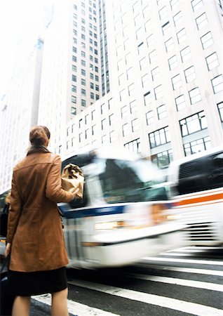 Woman waiting at pedestrian crossing Stock Photo - Premium Royalty-Free, Code: 632-01137182