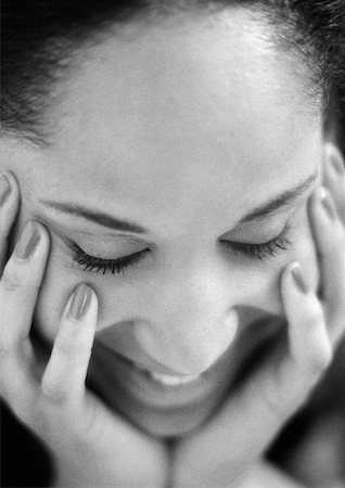 Woman holding face with hands, eyes closed, close-up, B&W. Stock Photo - Premium Royalty-Free, Code: 632-01139129