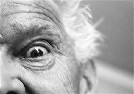 senior eyes - Senior man staring at camera, low angle partial view, b&w Stock Photo - Premium Royalty-Free, Code: 632-01144200