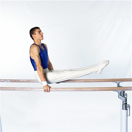 simsearch:632-05759602,k - Young male gymnast on parallel bars, side view Stock Photo - Premium Royalty-Free, Code: 632-01144983