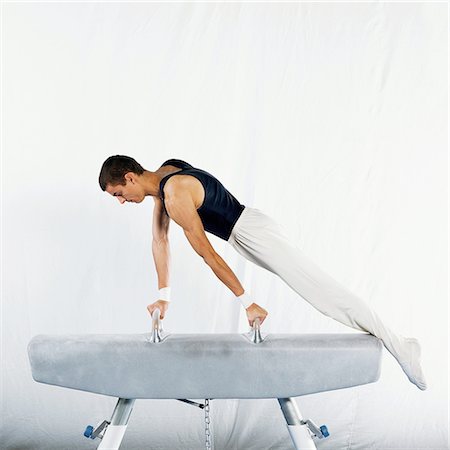 simsearch:632-01145012,k - Male gymnast on pommel horse, side view Stock Photo - Premium Royalty-Free, Code: 632-01144996