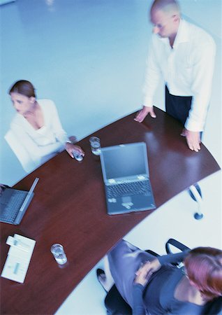 Business people around desk, elevated view Stock Photo - Premium Royalty-Free, Code: 632-01146065