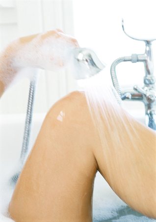 Woman's knee in bathtub, close-up Stock Photo - Premium Royalty-Free, Code: 632-01146570