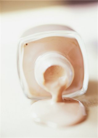 foundation cosmetics - Foundation spilling out of bottle, close-up Stock Photo - Premium Royalty-Free, Code: 632-01147145