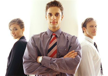 simsearch:632-05604394,k - Business people standing together, waist up Stock Photo - Premium Royalty-Free, Code: 632-01147822