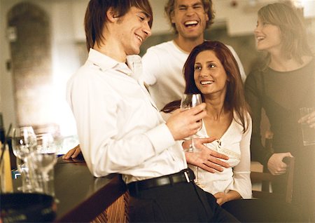 friends drinking bar - Young men and women drinking at bar Stock Photo - Premium Royalty-Free, Code: 632-01147886