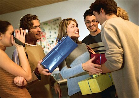Group of people exchanging presents Stock Photo - Premium Royalty-Free, Code: 632-01147917