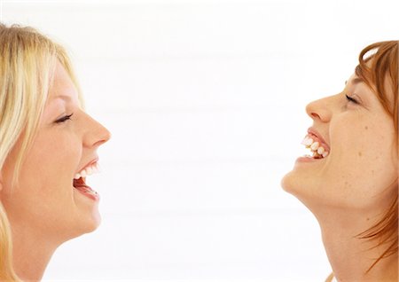 side profile portrait eyes closed studio - Two women laughing with heads back and eyes closed Stock Photo - Premium Royalty-Free, Code: 632-01148119