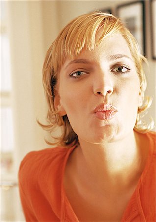 Teenage girl puckering lips, portrait Stock Photo - Premium Royalty-Free, Code: 632-01148144