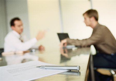 Businessmen working together in office space, blurred. Stock Photo - Premium Royalty-Free, Code: 632-01148316