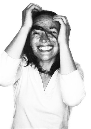 silhouette black and white - Woman laughing, hands on head, portrait Stock Photo - Premium Royalty-Free, Code: 632-01148989