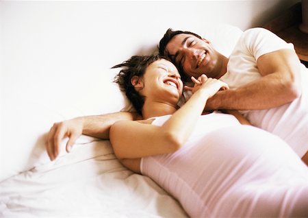 diffuse - Man and pregnant woman side by side on bed Stock Photo - Premium Royalty-Free, Code: 632-01140105