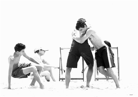 Family playing on beach, b&w Stock Photo - Premium Royalty-Free, Code: 632-01141832