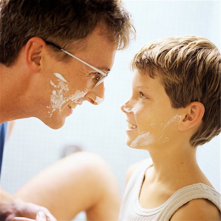 father and son and shave - Father and son with shaving cream on faces, side view Stock Photo - Premium Royalty-Free, Code: 632-01142311