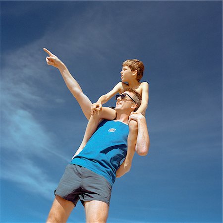 simsearch:695-03385136,k - Boy sitting on father's shoulders, man pointing, low angle view Stock Photo - Premium Royalty-Free, Code: 632-01142768
