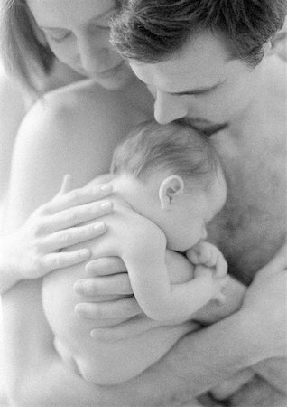 Mother and father with sleeping infant, b&w Stock Photo - Premium Royalty-Free, Code: 632-01143046