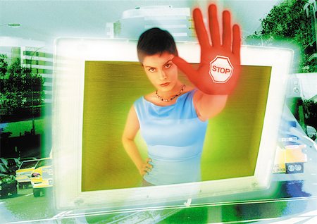 screen car - Young woman emerging from computer monitor, hand toward camera, the word "stop" on hand, digital composite. Stock Photo - Premium Royalty-Free, Code: 632-01143884