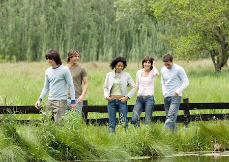 simsearch:695-03382465,k - Group of young friends walking outdoors Stock Photo - Premium Royalty-Free, Code: 632-01154550
