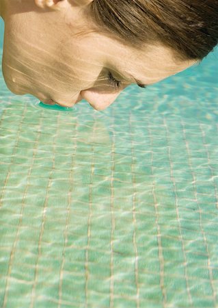 puckered lips profile - Woman touching lips to surface of water Stock Photo - Premium Royalty-Free, Code: 632-01154923