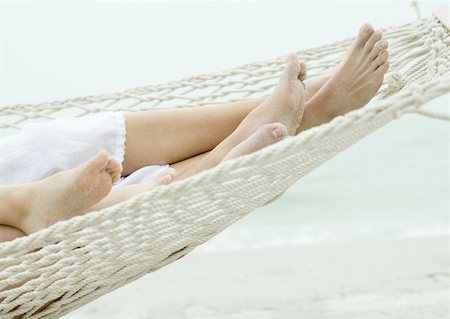 Family lying in hammock together, close-up of feet Stock Photo - Premium Royalty-Free, Code: 632-01155320