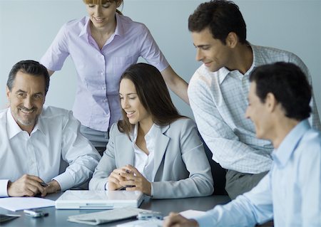 simsearch:632-01155400,k - Business team in casual meeting, smiling Stock Photo - Premium Royalty-Free, Code: 632-01155420