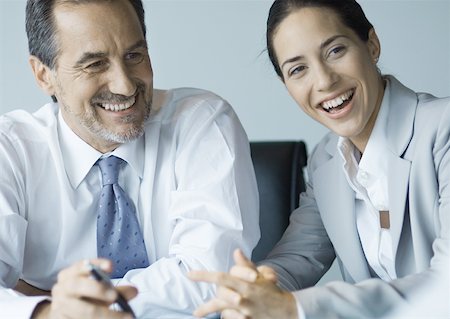 simsearch:632-01155400,k - Business colleagues working together, smiling Stock Photo - Premium Royalty-Free, Code: 632-01155422