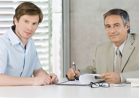 simsearch:632-01155457,k - Young man with mature business man, smiling at camera Stock Photo - Premium Royalty-Free, Code: 632-01155457