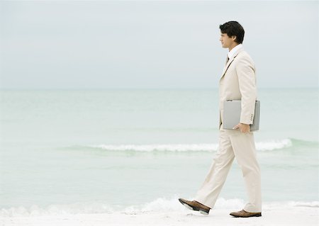 simsearch:632-01160695,k - Man carrying laptop under arm, on beach Stock Photo - Premium Royalty-Free, Code: 632-01155553