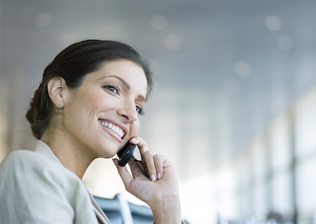 simsearch:695-03380514,k - Woman using cell phone, smiling Stock Photo - Premium Royalty-Free, Code: 632-01155600
