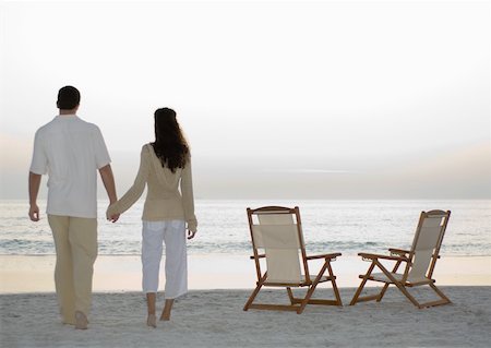 deck chair beach back view - Newlyweds standing on beach, looking at view Stock Photo - Premium Royalty-Free, Code: 632-01156249