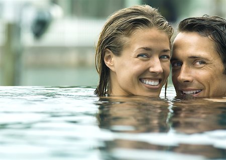 simsearch:632-03779625,k - Couple smiling in pool Stock Photo - Premium Royalty-Free, Code: 632-01156289