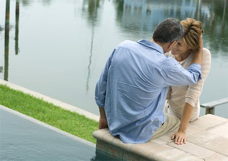 simsearch:632-03779625,k - Couple sitting by edge of water Stock Photo - Premium Royalty-Free, Code: 632-01156291