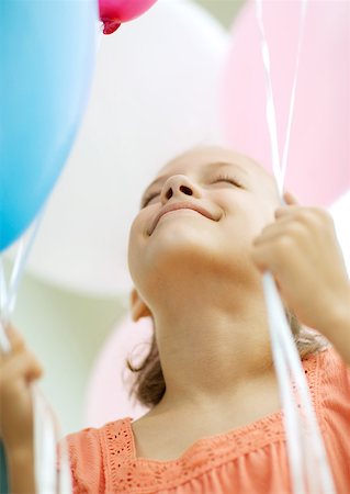 Girl holding balloons Stock Photo - Premium Royalty-Free, Code: 632-01156355