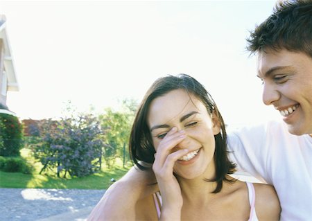 embarrassed kid - Young couple laughing Stock Photo - Premium Royalty-Free, Code: 632-01156418