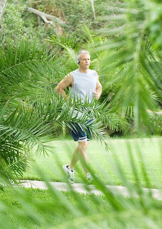 floridian - Mature man jogging on walkway Stock Photo - Premium Royalty-Free, Code: 632-01156435