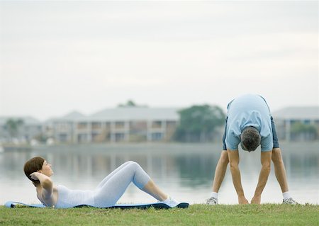 simsearch:695-03373919,k - Couple working out by edge of water Stock Photo - Premium Royalty-Free, Code: 632-01156449