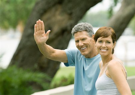 Mature couple, man waving Stock Photo - Premium Royalty-Free, Code: 632-01156440