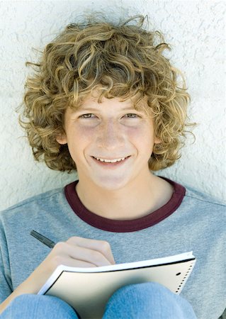 Preteen boy writing, portrait Stock Photo - Premium Royalty-Free, Code: 632-01156636