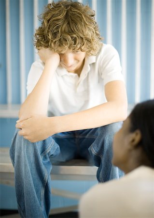 Teen boy facing teen girl, holding head Stock Photo - Premium Royalty-Free, Code: 632-01156776