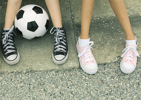 soccer ball sneaker - Two children sitting on curb, view of feet Stock Photo - Premium Royalty-Free, Code: 632-01156970