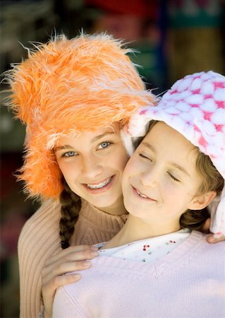 Two girls wearing funny hats, portrait Stock Photo - Premium Royalty-Free, Code: 632-01157238