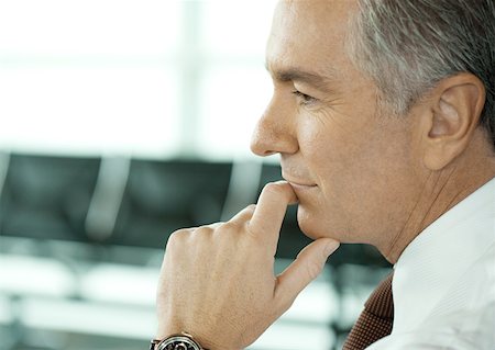 portrait business person close thinking not looking at camera - Man sitting in airport lounge, close-up of face Stock Photo - Premium Royalty-Free, Code: 632-01157679