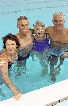 simsearch:632-01146640,k - Two mature couples standing in swimming pool Foto de stock - Sin royalties Premium, Código: 632-01158627