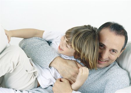 Father holding son in arms, laughing Stock Photo - Premium Royalty-Free, Code: 632-01151568