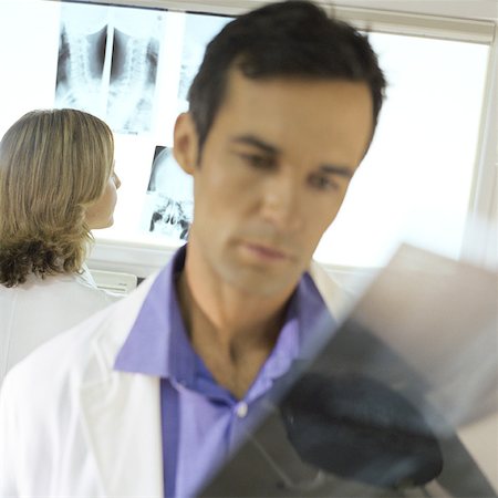 doctor looking at xray - Doctors in x-ray lab Stock Photo - Premium Royalty-Free, Code: 632-01152780