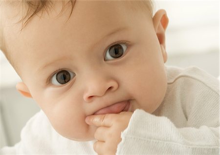 Baby sticking tongue out, portrait Stock Photo - Premium Royalty-Free, Code: 632-01153326