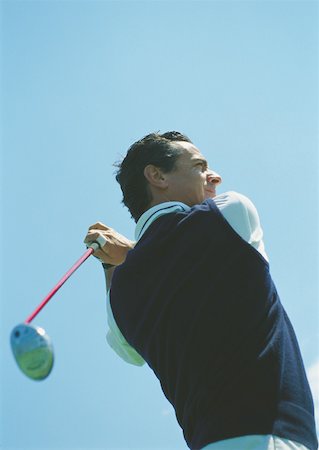 Golfer swinging Stock Photo - Premium Royalty-Free, Code: 632-01153366