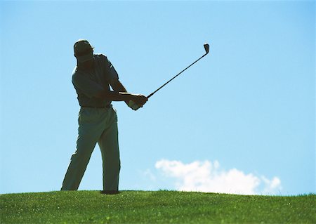 Golfer swinging Stock Photo - Premium Royalty-Free, Code: 632-01153375