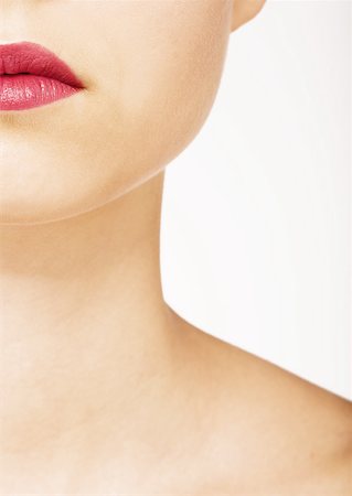 simsearch:632-01154783,k - Woman wearing lipstick, view of lower face and neck Foto de stock - Royalty Free Premium, Número: 632-01153410